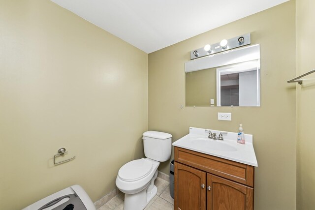 1892 Keystone Pl, Schaumburg, IL 60193 - half bathroom featuring toilet, vanity, baseboards, and tile patterned floors