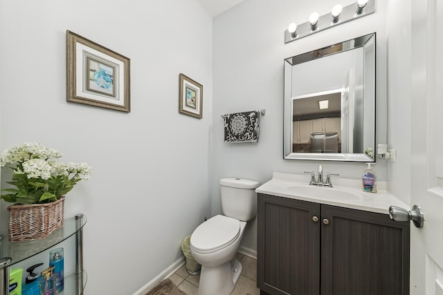 1892 Keystone Pl, Schaumburg, IL 60193 - half bathroom featuring baseboards, vanity, toilet, and tile patterned floors
