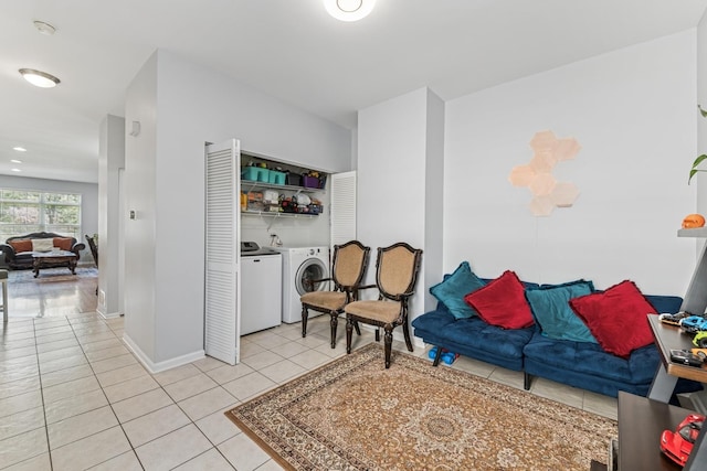 1892 Keystone Pl, Schaumburg, IL 60193 - living area featuring washer and clothes dryer, light tile patterned flooring, and baseboards