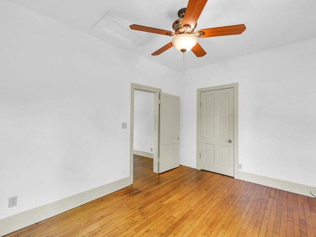 413 E Lincoln St, Monticello, IL 61856 - empty room featuring ceiling fan and light wood-type flooring