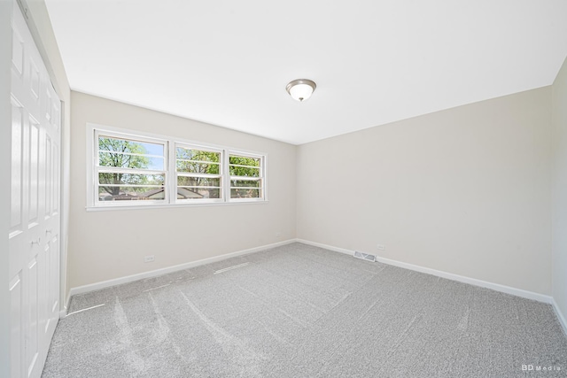 15320 Harding Ave, Midlothian, IL 60445 - spare room featuring baseboards and carpet flooring