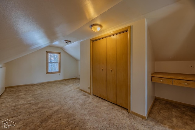 3525 N Ottawa Ave, Chicago, IL 60634 - additional living space featuring light colored carpet, lofted ceiling, and baseboards