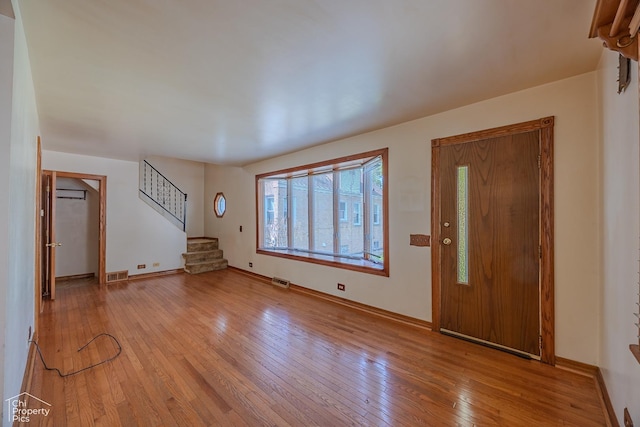 3525 N Ottawa Ave, Chicago, IL 60634 - entryway with stairs, light wood-style flooring, and baseboards