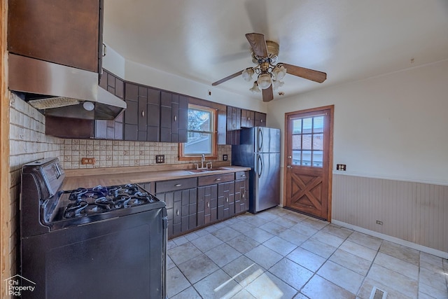 3525 N Ottawa Ave, Chicago, IL 60634 - kitchen featuring range with gas cooktop, a sink, freestanding refrigerator, ceiling fan, and plenty of natural light