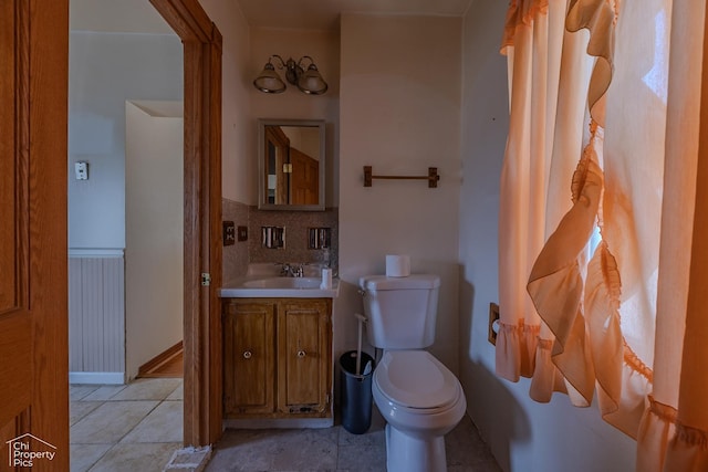 3525 N Ottawa Ave, Chicago, IL 60634 - bathroom with toilet, vanity, and wainscoting