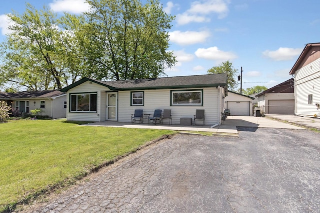 view of front facade with a front lawn and a garage