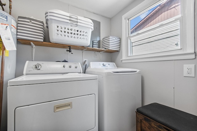 clothes washing area with separate washer and dryer