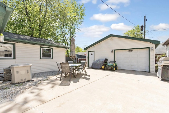 view of patio / terrace with an outdoor structure, central AC, outdoor dining area, and a grill