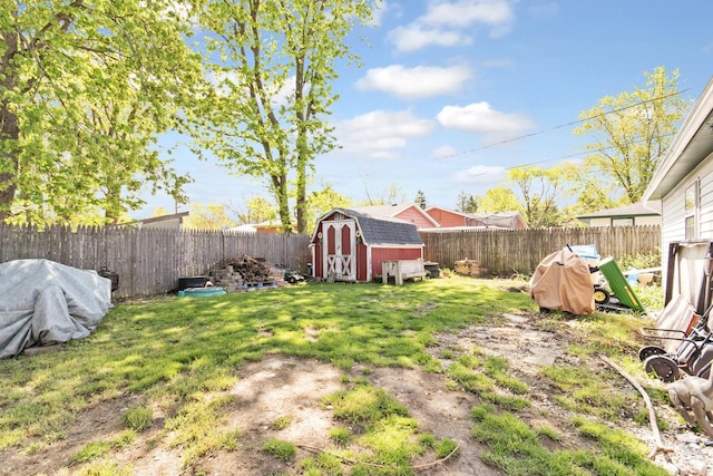 view of yard featuring a storage unit and an outbuilding
