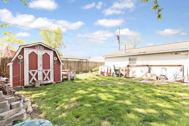 view of yard with a storage shed and an outdoor structure