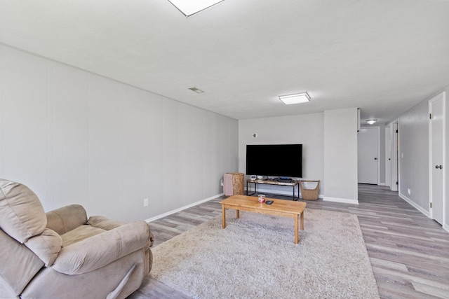 living room with light wood-style floors and baseboards