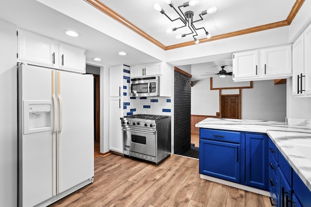kitchen with stainless steel appliances, blue cabinetry, white cabinets, crown molding, and light wood-type flooring