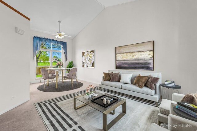 carpeted living area with lofted ceiling and ceiling fan