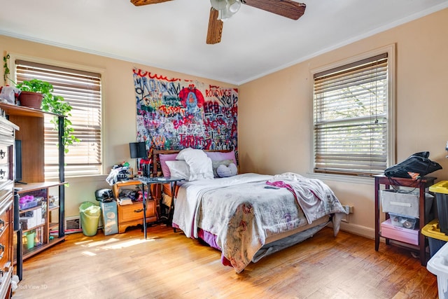 9245 S Justine St, Chicago, IL 60620 - bedroom featuring crown molding, wood finished floors, and ceiling fan