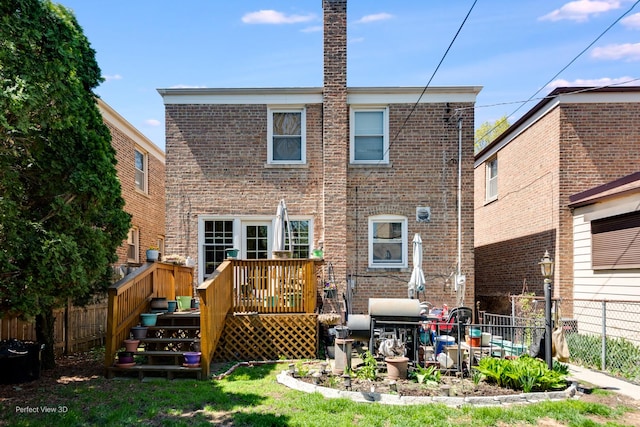 9245 S Justine St, Chicago, IL 60620 - back of property featuring brick siding, fence, and a wooden deck
