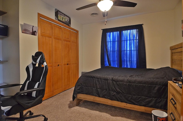 bedroom with light carpet, a closet, and ceiling fan