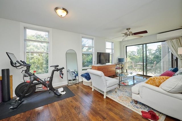 213 W Wisconsin St, Chicago, IL 60614 - living area featuring an AC wall unit, wood finished floors, ceiling fan, and healthy amount of natural light