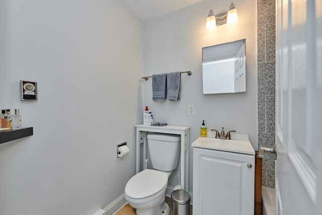 213 W Wisconsin St, Chicago, IL 60614 - bathroom featuring toilet, vanity, and baseboards