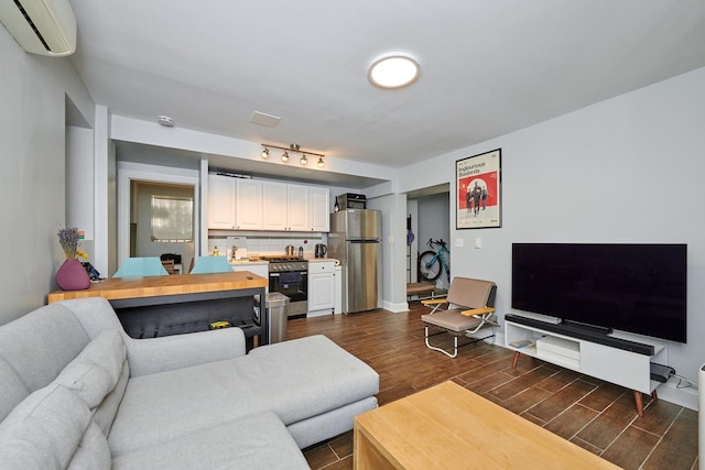 213 W Wisconsin St, Chicago, IL 60614 - living room featuring a wall unit AC, dark wood-style floors, and baseboards