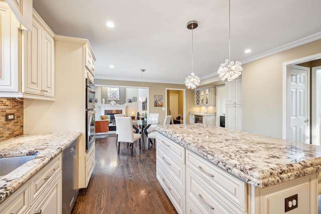 kitchen featuring cream cabinetry, dishwasher, dark wood finished floors, backsplash, and light stone countertops