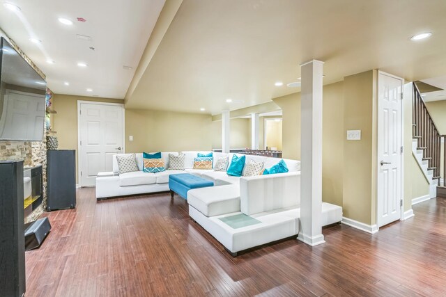 living room with stairway, wood finished floors, recessed lighting, and baseboards