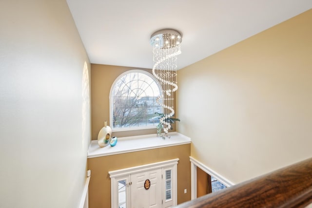 foyer featuring a chandelier