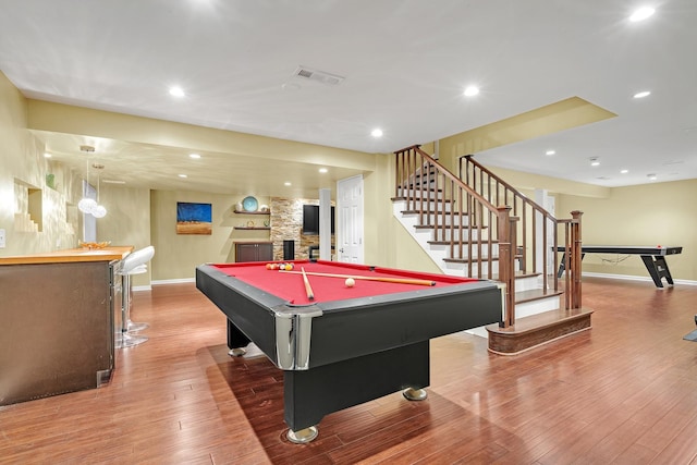 playroom with baseboards, bar, billiards table, wood finished floors, and recessed lighting