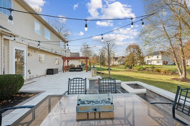 view of patio / terrace with an outdoor fire pit, a jacuzzi, and a pergola
