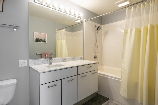 bathroom with shower / tub combo, vanity, and toilet