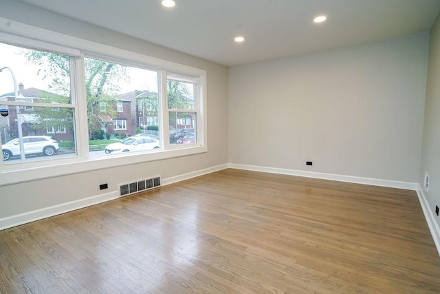 9539 S Forest Ave, Chicago, IL 60628 - unfurnished room with light wood-type flooring, baseboards, and recessed lighting