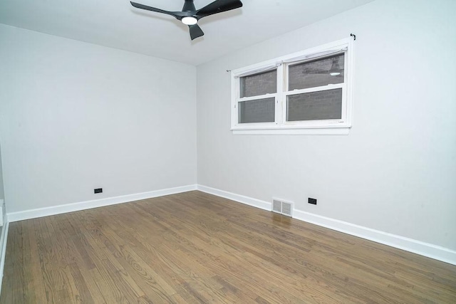 9539 S Forest Ave, Chicago, IL 60628 - empty room with wood finished floors, a ceiling fan, and baseboards