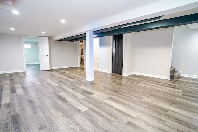 9539 S Forest Ave, Chicago, IL 60628 - finished basement featuring wood finished floors, recessed lighting, stairway, and baseboards
