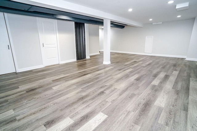 9539 S Forest Ave, Chicago, IL 60628 - finished below grade area featuring wood finished floors, recessed lighting, and baseboards