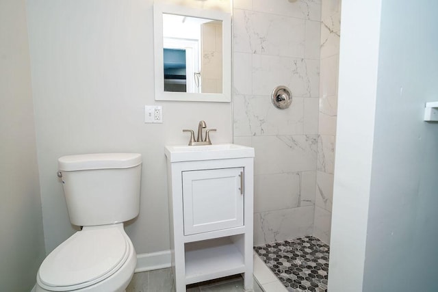 9539 S Forest Ave, Chicago, IL 60628 - bathroom with a tile shower, toilet, and vanity