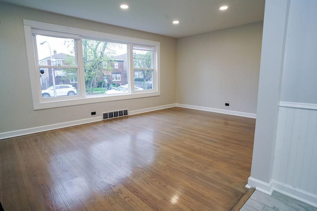 9539 S Forest Ave, Chicago, IL 60628 - unfurnished room with wood finished floors, baseboards, and recessed lighting
