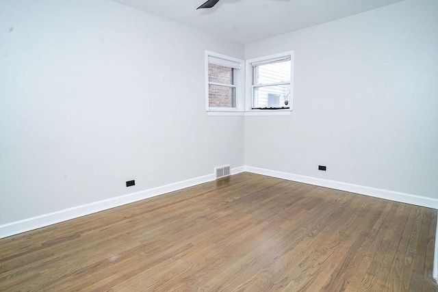 9539 S Forest Ave, Chicago, IL 60628 - spare room with a ceiling fan, baseboards, and wood finished floors