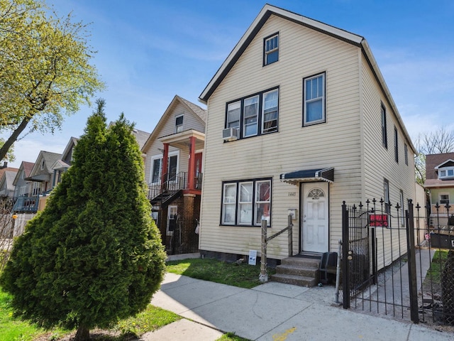 1443 W 49th Pl, Chicago, IL 60609 - view of front of property featuring fence, cooling unit, and a gate