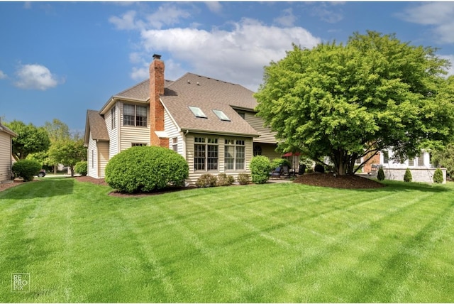 2708 Chittenden Ct, Naperville, IL 60564 - rear view of property featuring a chimney, a yard, and roof with shingles