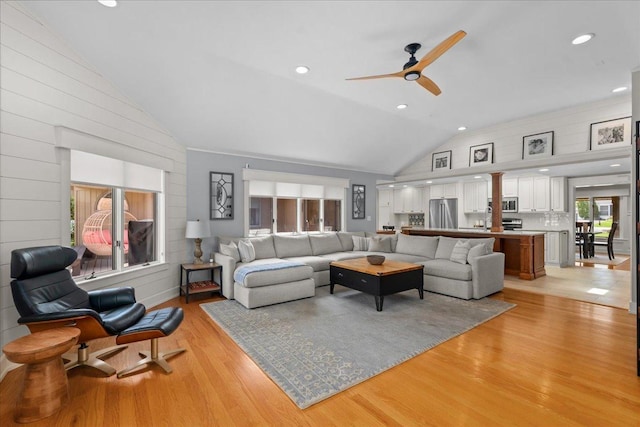 208 N Pkwy, Prospect Heights, IL 60070 - living area featuring lofted ceiling, ceiling fan, light wood-style floors, and wooden walls