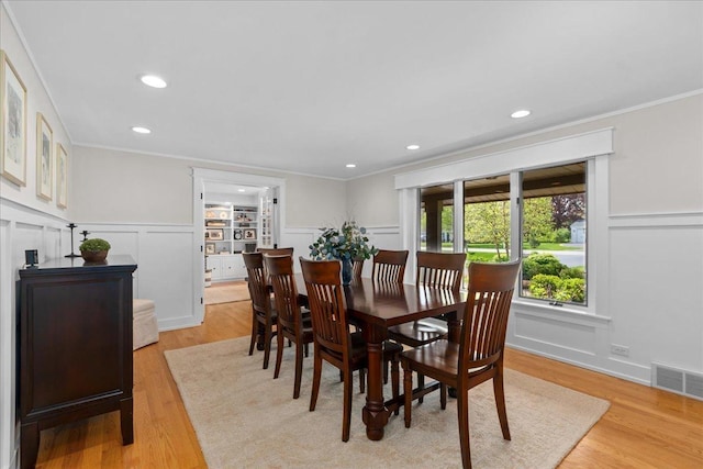 208 N Pkwy, Prospect Heights, IL 60070 - dining space with a decorative wall, ornamental molding, light wood-type flooring, recessed lighting, and a wainscoted wall