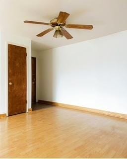 135 S Kenilworth Ave Unit 8, Oak Park, IL 60302 - unfurnished room featuring light wood-type flooring, baseboards, and ceiling fan