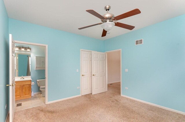 21508 Lake St Clair Dr Unit 0, Crest Hill, IL 60403 - unfurnished bedroom featuring light carpet, a sink, baseboards, ensuite bath, and ceiling fan