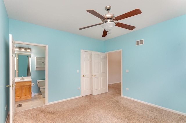 21508 Lake St Clair Dr Unit 0, Crest Hill, IL 60403 - unfurnished bedroom with light carpet, a sink, baseboards, connected bathroom, and a ceiling fan