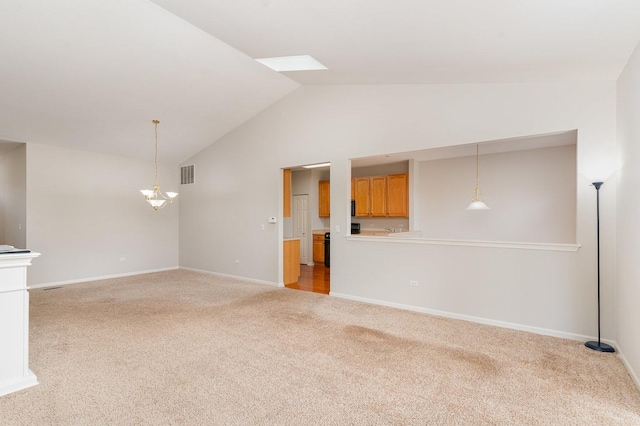21508 Lake St Clair Dr Unit 0, Crest Hill, IL 60403 - unfurnished living room with light carpet, high vaulted ceiling, a chandelier, baseboards, and a skylight