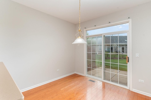 21508 Lake St Clair Dr Unit 0, Crest Hill, IL 60403 - unfurnished dining area with light wood-style floors and baseboards