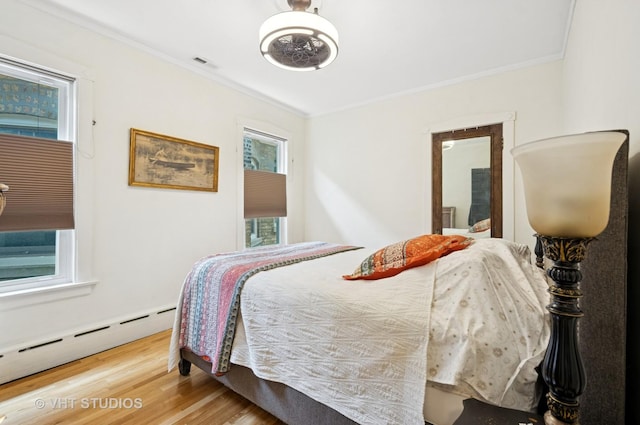 2950 W Wilson Ave, Chicago, IL 60625 - bedroom with a baseboard radiator, ornamental molding, wood finished floors, and ceiling fan
