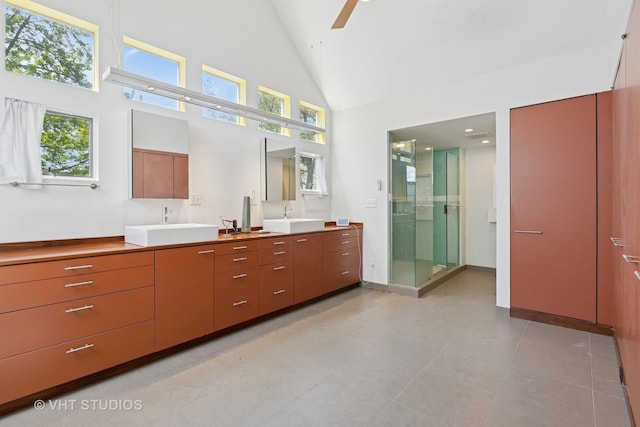 1534 W Henderson St, Chicago, IL 60657 - full bathroom with high vaulted ceiling, a ceiling fan, a stall shower, vanity, and tile patterned floors
