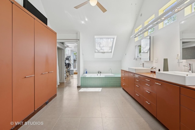 1534 W Henderson St, Chicago, IL 60657 - full bathroom with a high ceiling, ceiling fan, double vanity, a bath, and tile patterned flooring