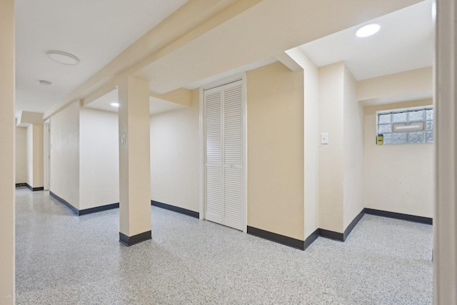 5814 W Roscoe St, Chicago, IL 60634 - additional living space featuring baseboards and speckled floor