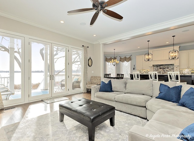 75 N Lake Ave, Third Lake, IL 60030 - living area with a chandelier, light wood-style floors, ceiling fan, crown molding, and recessed lighting